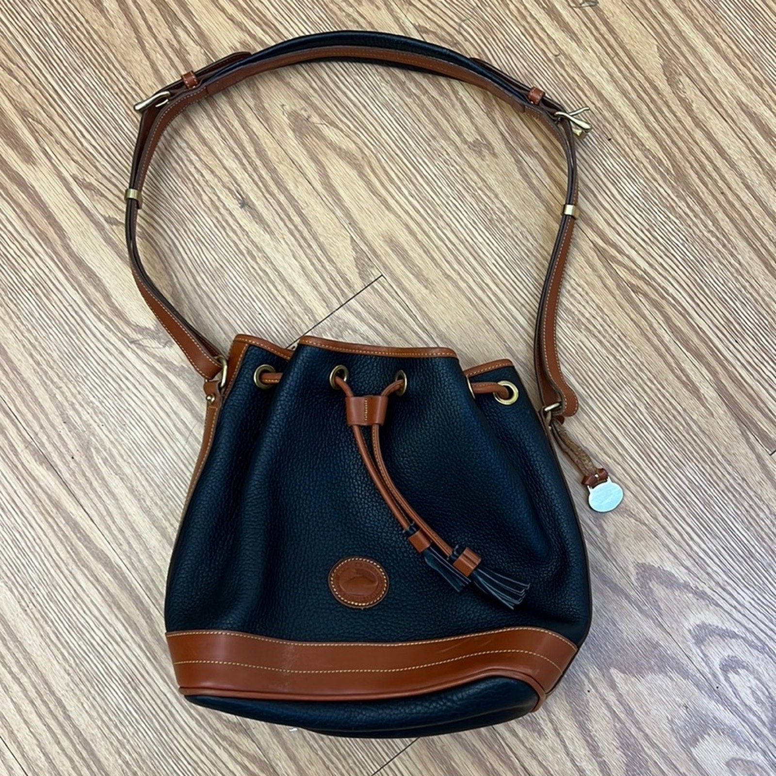 Dooney & Bourke Tassel Bucket Bag Blue Pebbled Leather Tan Accent Gold Hardware